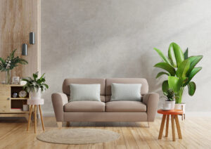 Brown sofa and a wooden table in living room interior with plant